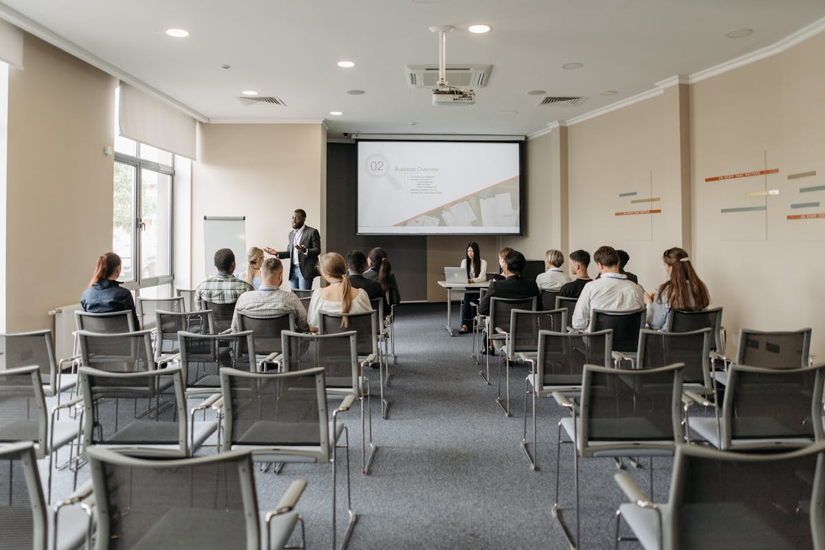 Team attending a professional business presentation in modern conference room